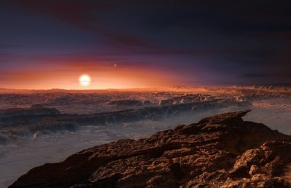 This artist's impression shows a view of the surface of the planet Proxima b orbiting the red dwarf star Proxima Centauri, the closest star to the Solar System. The double star Alpha Centauri AB also appears in the image to the upper-right of Proxima itself. Proxima b is a little more massive than the Earth and orbits in the habitable zone around Proxima Centauri, where the temperature is suitable for liquid water to exist on its surface.