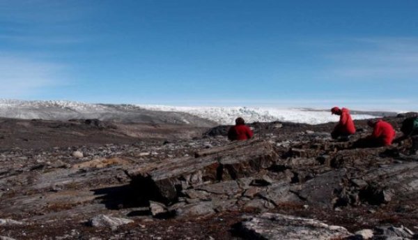 Associate Professor Vickie Bennett (left), Professor Allen Nutman (centre), and Dr Clark Friend (right), examining the rocks in Greenland.
