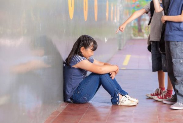 Bullied girl. The detrimental effects of bullying may linger for years.