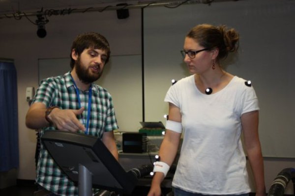 Liam Satchell with a participant.