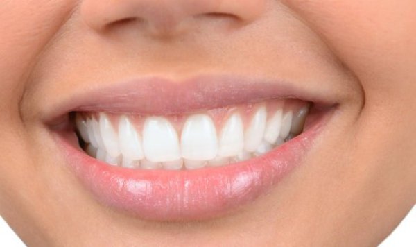 Straight teeth (stock image). Dental occlusion is simply the contact made between the top and bottom teeth when closing the mouth. Teeth may be perfectly aligned or they may present alterations with varying levels of severity.