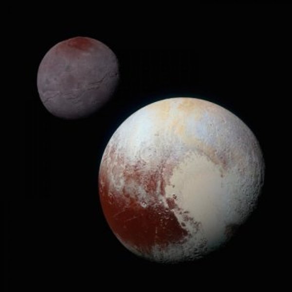 Pluto, shown here in the front of this false-color image, has a bright ice-covered 'heart.' The left, roughly oval lobe is the basin provisionally named Sputnik Planitia. Sputnik Planitia appears directly opposite Pluto's moon, Charon (back).