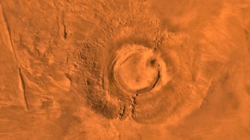 This digital-image mosaic of Mars' Tharsis plateau shows the extinct volcano Arsia Mons. It was assembled from images that the Viking 1 Orbiter took during its 1976-1980 working life at Mars.