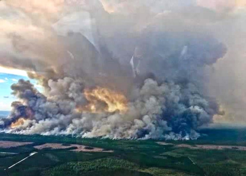 Okefenokee Swamp Wildfire Smoke rises from the wildfire burning across 150,000 acres of the Okefenokee Swamp in Georgia and Florida.