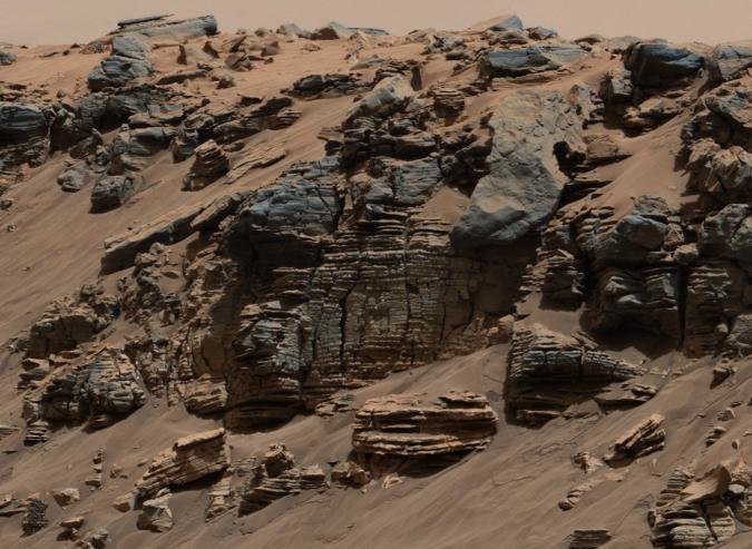 Sedimentary Signs of a Martian Lakebed (Shallow Part): This evenly layered rock imaged in 2014 by the Mastcam on NASA's Curiosity Mars rover shows a pattern typical of a lake-floor sedimentary deposit near where flowing water entered a lake. Shallow and deep parts of an ancient Martian lake left different clues in mudstone formed from lakebed deposits.