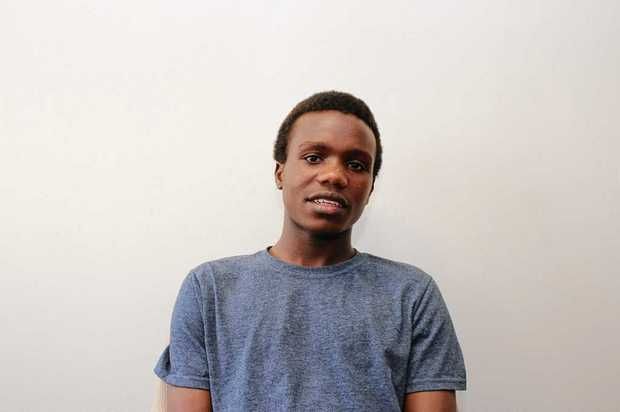 Patrick Tuyizere, 18, who was born in a Rwanda refugee camp after escaping conflict in the Congo. He's one of six Utica students suing the district.