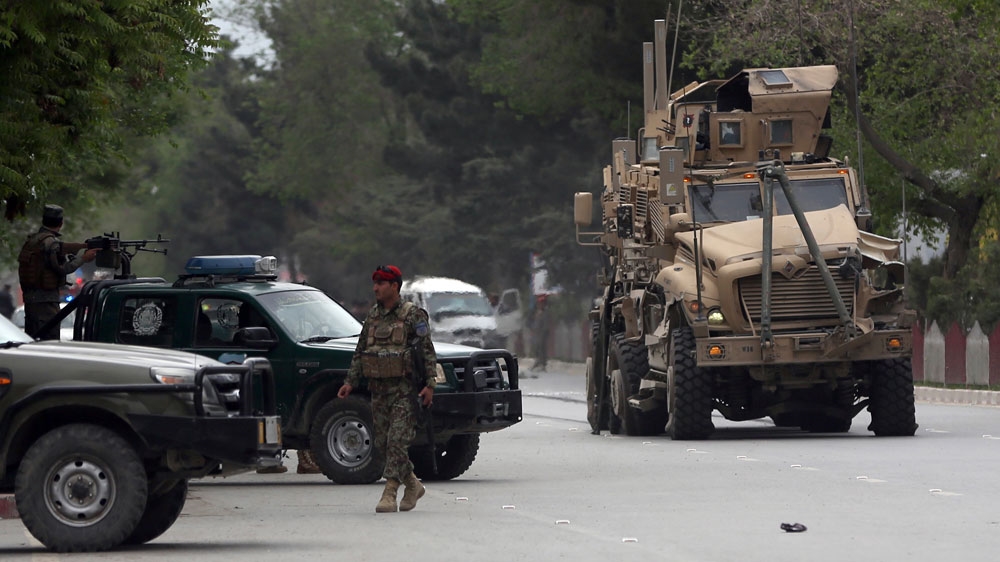 A damaged military vehicle was being pulled near the site of the attack in Kabul