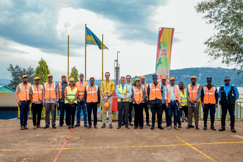 The delegation from MINICOM in a group photo with the management of SKOL brewery during the visit.
