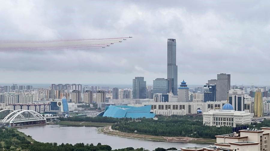 Kazakh fighter jets paint the sky with colored smoke trails as Kazakh President Kassym-Jomart Tokayev hosts a welcome ceremony for visiting Chinese President Xi Jinping, in Astana, Kazakhstan, July 3, 2024.  (Xinhua/Lu Jinbo)