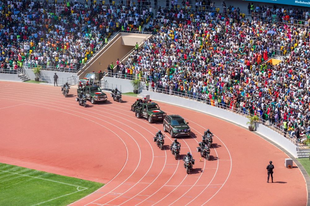 A team of RDF officers arrives at Amahoro stadium with national instruments including the national flag