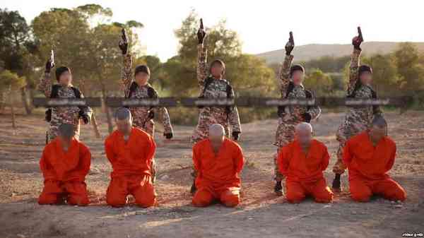 A screenshot from an Islamic State propaganda video that purports to show young boys executing Kurdish fighters.