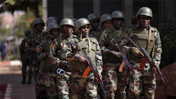 Soldiers patrol the capital Bamako in November 2015 following an attack on a hotel
