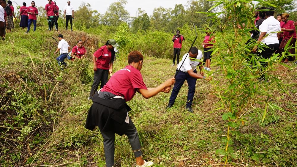 Officials and students of University of Kigali (UoK), participating in community work.