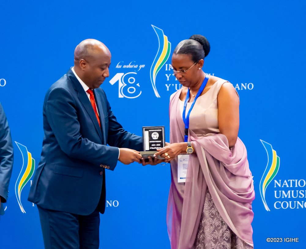 The Mayor of Rulindo District, Mukanyirigira Judith receiving an award from Premier Ngirente.  