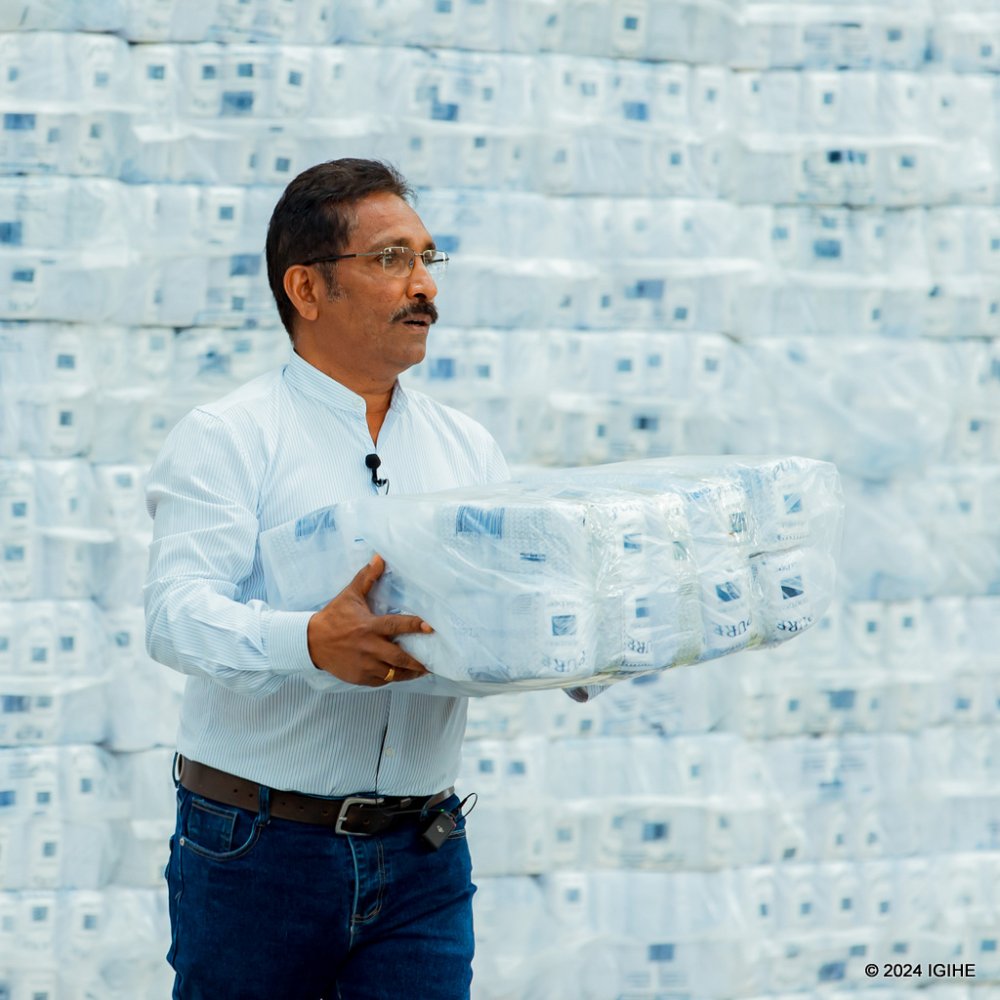 Anir Kumar, the plant manager presenting some of manufactured toilet papers.