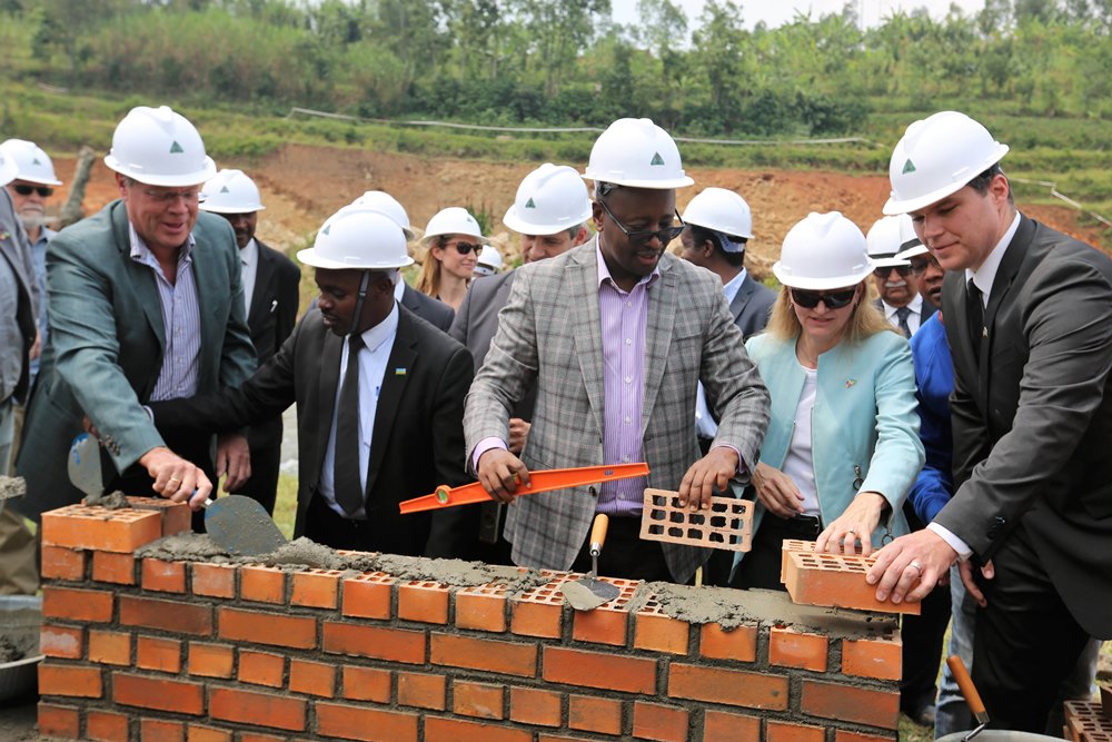 The Minister of Infrastructure James Musoni, U.S. Ambassador to Rwanda Erica Barks-Ruggles, German Ambassador to Rwanda Dr. Peter Woeste and other project partners laying a foundation stone at  Rwaza I hydropower plant in Musanze district yesterday. 