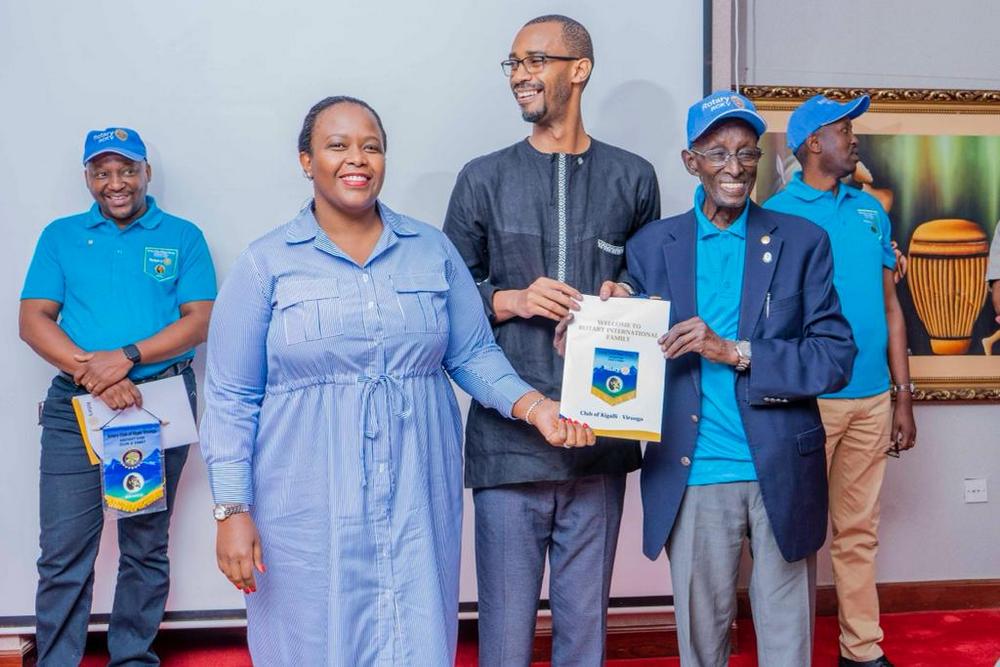 Alex Ndibwami, the husband of Clare Akamanzi on his admission into Rotary Club Kigali Virunga.