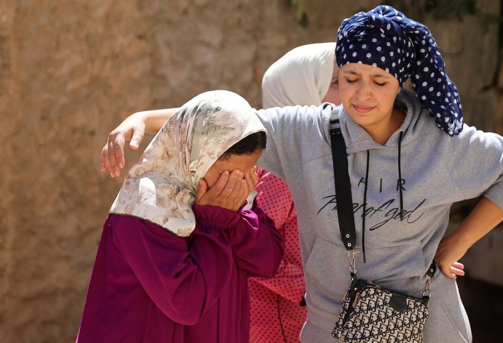 A resident bursts into tears near the epicenter at Amizmiz Village in Morocco, Sept. 10, 2023.(Xinhua/Wang Dongzhen)