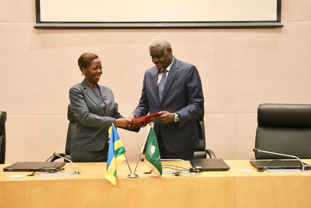 Mushikiwabo hands the ratification instruments to AUC Chairperson Moussa Faki Mahamat yesterday in Ethiopia