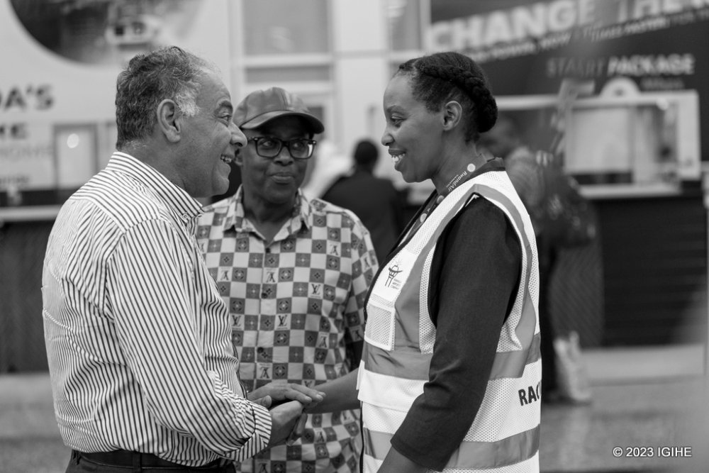 The Director General of Immigration and Emigration, Lynder Nkuranga interacting with evacuees. 