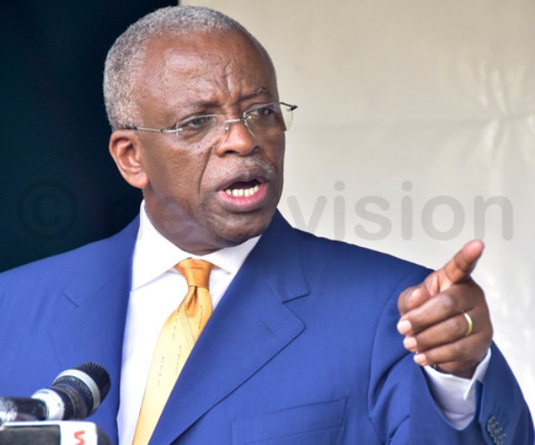 Amama Mbabazi flew to the UK to be with his sick wife.