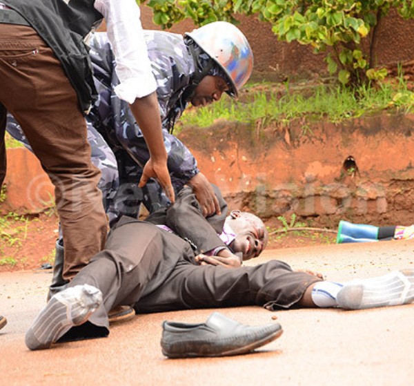 Isaac Kugonza a journalists with a local TV being helped by police after he was shot by rubber bullet during the scuffle when the police arrested Lord mayor Erias Lukwago this year. This was at Wakaliga in Kampala on November 16, 2015