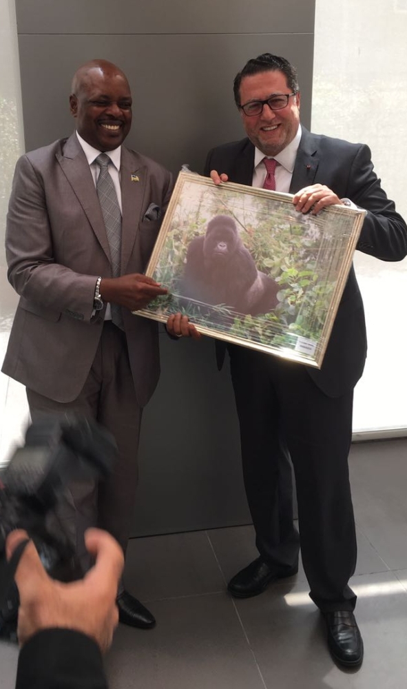 Rwanda's ambassador to Lebanon, Williams Nkurunziza offering the gift of gorilla image as one of  touristic attractions in Rwanda. 