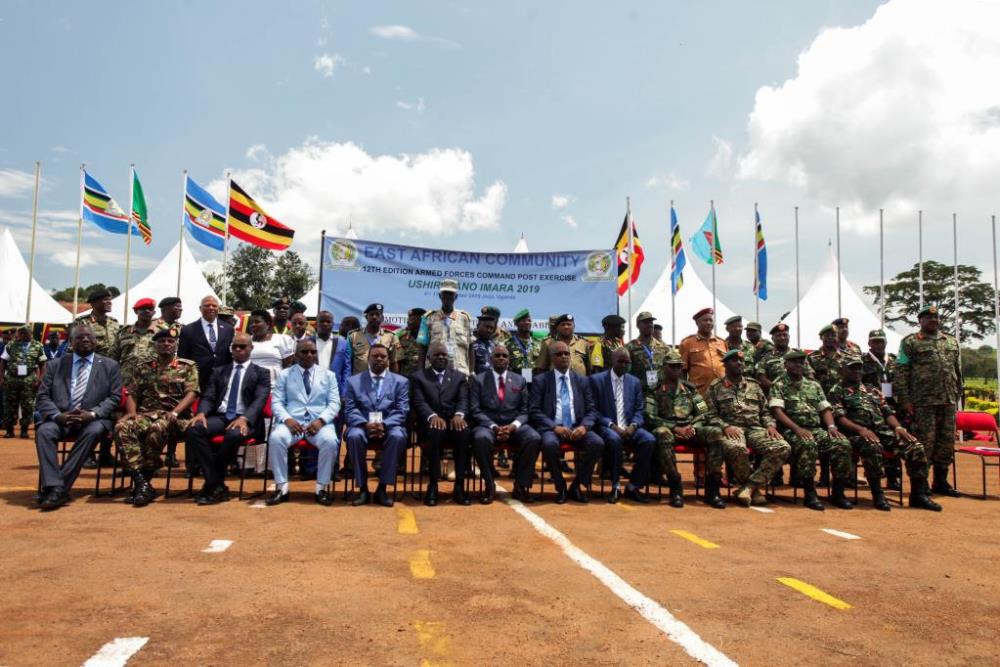 The file photo shows delegates posing for a group photo during the 12th edition of the Armed Forces Command Post Exercise of the East African Community (EAC) in Jinja, Uganda, Nov. 7, 2019. (Photo by Hajarah Nalwadda/Xinhua)