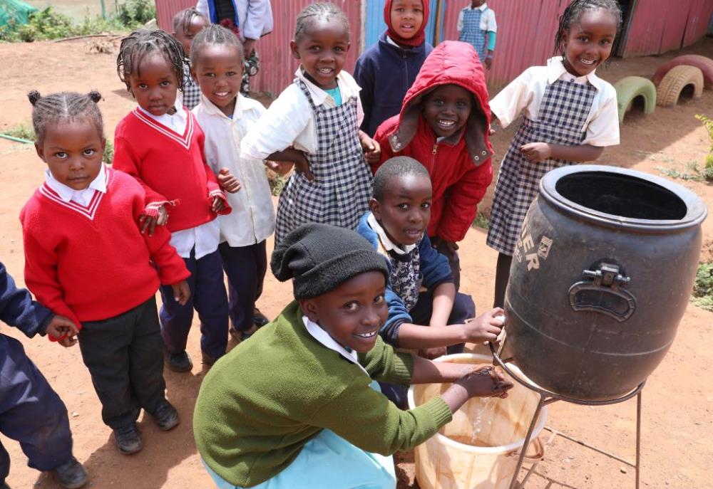 Children wash their hands before a meal at a kindergarten in Kimuka, Kenya, on Nov. 10, 2022. (Xinhua/Dong Jianghui)