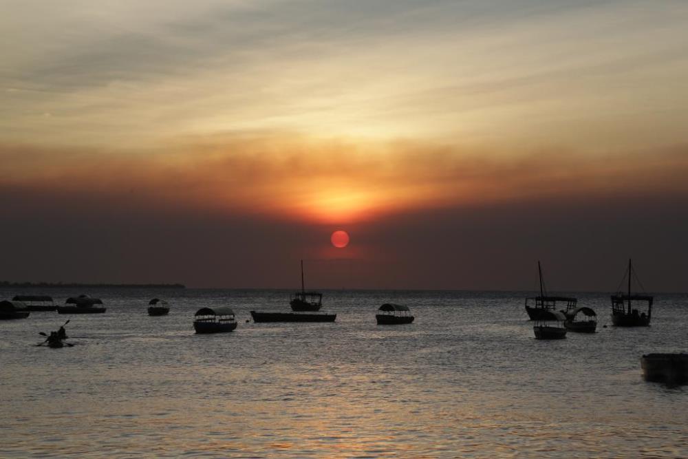 Photo taken on July 30, 2021 shows a sunset view in Zanzibar, Tanzania. (Photo by Herman Emmanuel/Xinhua)