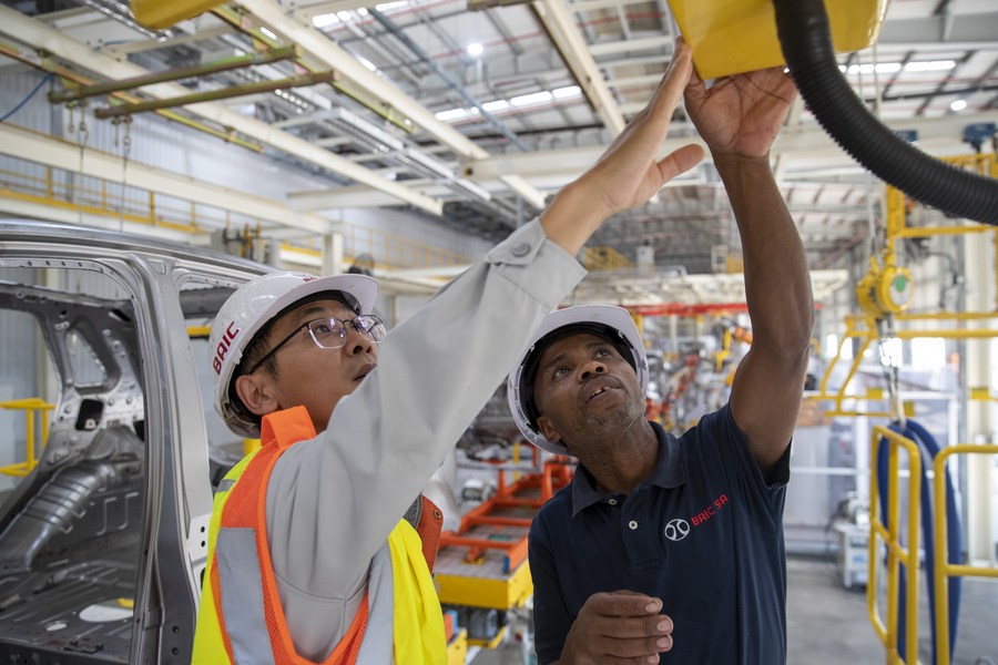 South African electrician Bongani Nciwa (R) works with his Chinese colleague Fang Long at a plant of the Chinese automaker Beijing Automotive Industry Corporation in Eastern Cape province of South Africa, May 9, 2023. (Xinhua/Zhang Yudong)
