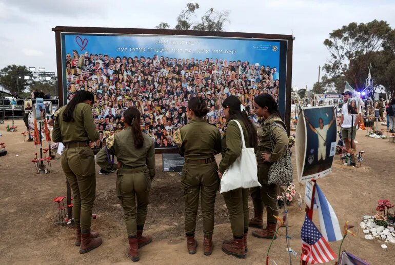 People visit the site of the Nova festival, where partygoers were killed and kidnapped during the Hamas-led October 7, 2023 attack, in Reim, southern Israel.
