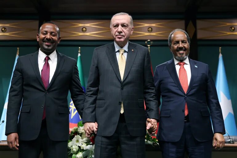 Turkish President Recep Tayyip Erdogan, centre, poses with Somali President Hassan Sheikh Mohamud, right, and Ethiopian Prime Minister Abiy Ahmed, left, following a news conference in Ankara, Turkiye, on December 11, 2024