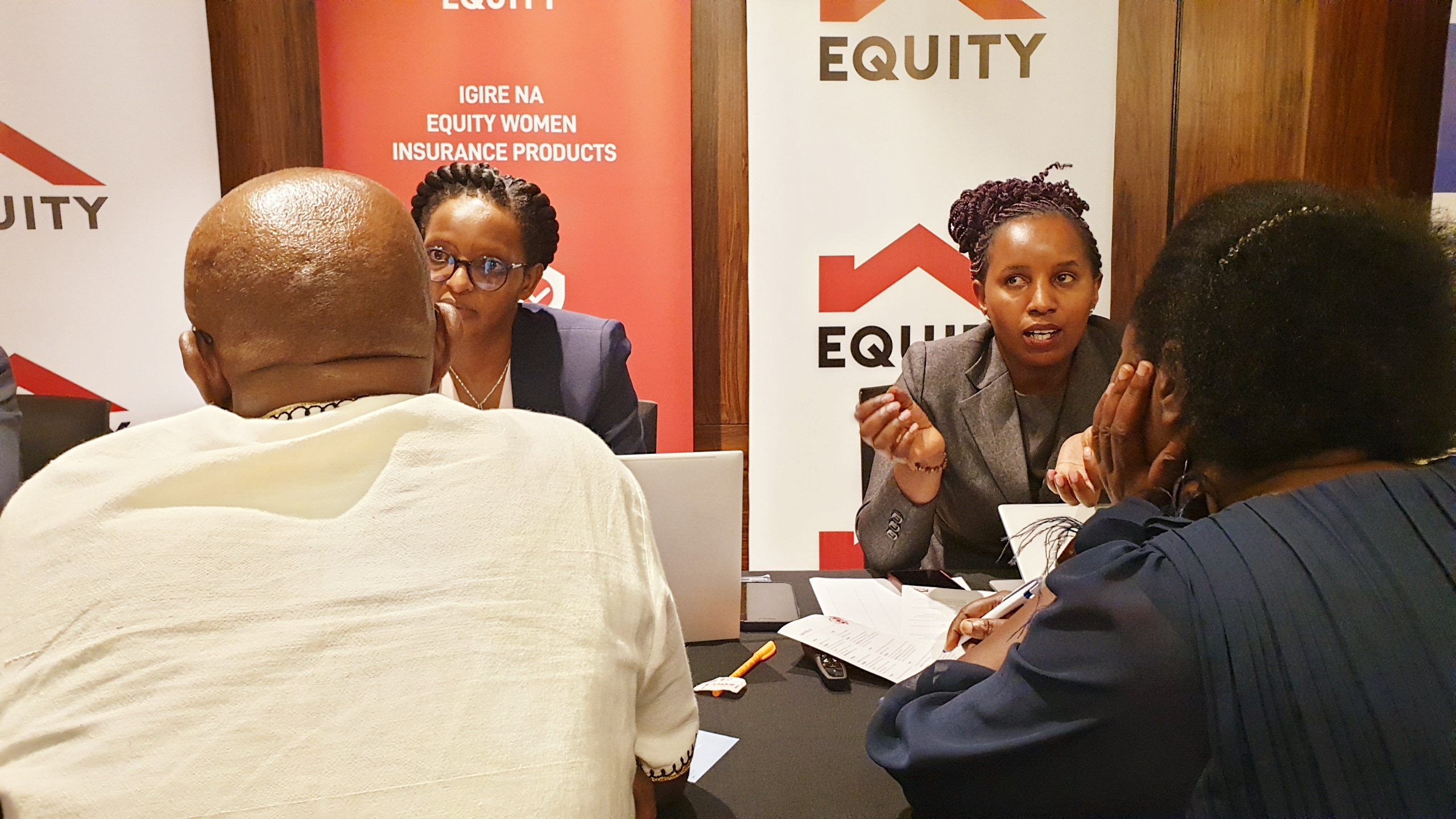 Representatives from Equity Bank engage local MSMEs during the networking event.