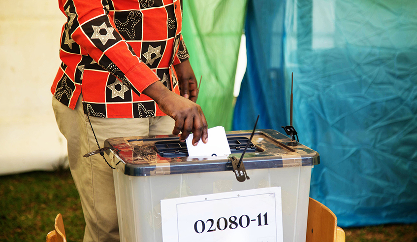 A voter casts his vote in a past election in Rwanda.