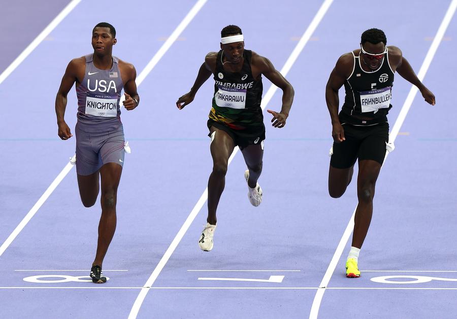 Erriyon Knighton of the United States, Tapiwanashe Makarawu of Zimbabwe, and Joseph Fahnbulleh of Liberia (from L to R) compete during the men's 200m semi-final at the Paris 2024 Olympic Games in Paris, France, Aug. 7, 2024. (Xinhua/Li Gang)