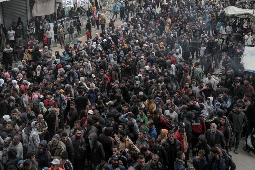 People wait to buy bread at a bakery in the southern Gaza Strip city of Khan Younis, on Nov. 18, 2024. The United Nations Relief and Works Agency for Palestine Refugees in the Near East (UNRWA) said many UN-supported bakeries have been operating at diminished capacity due to critical shortages of flour. (Photo by Rizek Abdeljawad/Xinhua)