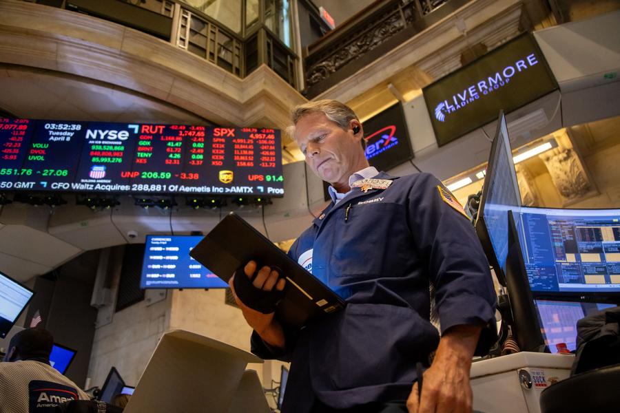 A trader works on the floor of the New York Stock Exchange in New York, the United States, on April 8, 2025.