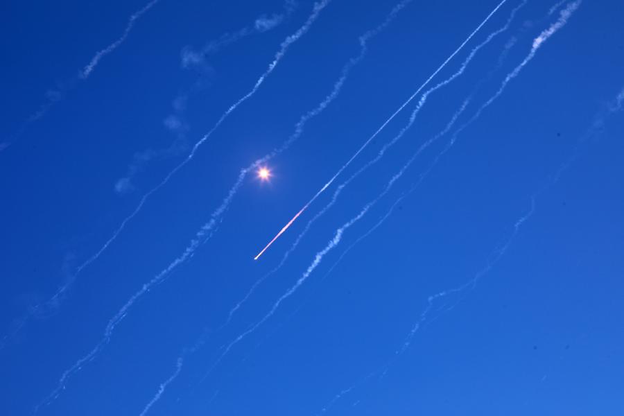 Missile traces are seen from the city of Hebron in the southern West Bank during Iran's missile attack against Israel, on June 19, 2025. 