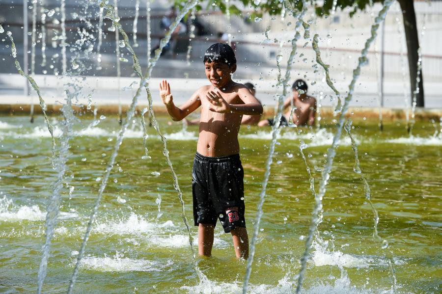 A boy cools off at a fountain in a park in Madrid, Spain, June 29, 2025. Spain has been hit by a new round of heatwave since Saturday, with temperatures in many regions expected to exceed 40 degrees Celsius in the coming days.
