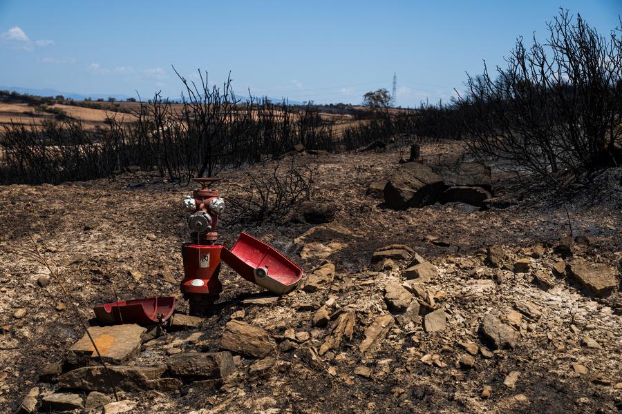 This photo taken on July 2, 2025 shows the burned land in Lleida province, Spain. Two farmers were killed in a wildfire that burned through 5,000 hectares in the La Segarra district of Lleida province, north-east Spain, on Tuesday, according to local emergency services.