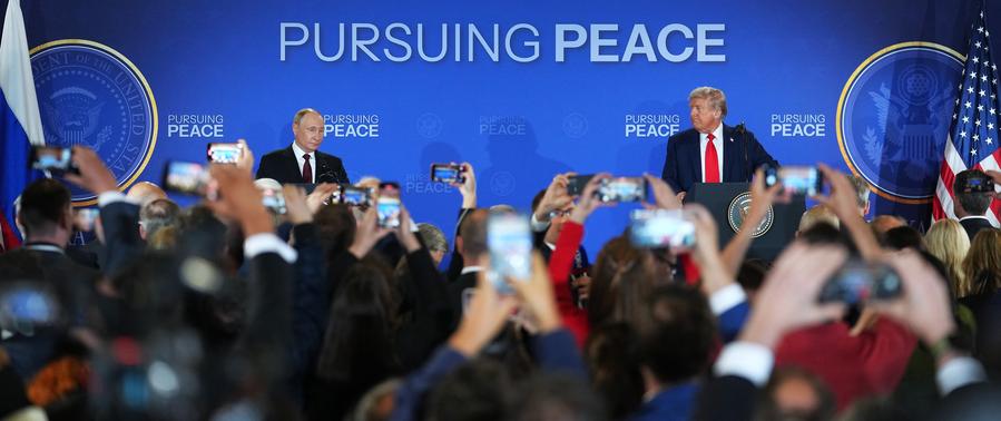 U.S. President Donald Trump (R, Rear) and Russian President Vladimir Putin (L, Rear) attend a joint press conference after concluding their talks in Anchorage, Alaska, the United States, on August 15, 2025.