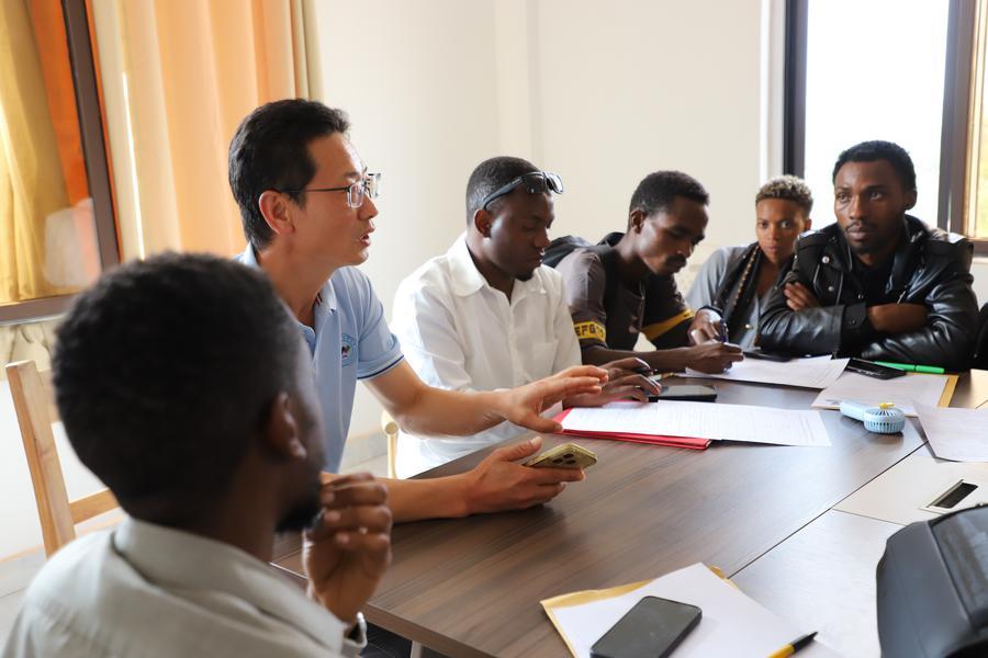 Qian Xiangming (2nd L), dean of Musanze International College at Jinhua University of Vocational Technology (JUVT), provides employment guidance to Rwandan graduates at a Chinese-funded enterprise in Eastern Province, Rwanda, January 5, 2026.
