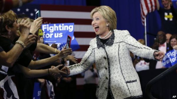 Democratic presidential candidate Hillary Clinton greets supporters as she arrives to speak at her election night watch party for the South Carolina Democratic presidential primary in Columbia, Feb. 27, 2016.
