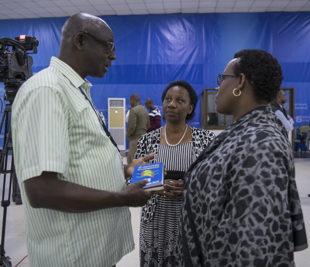 Minister of Justice and the Attorney General, Johnston Busingye chats with other leaders in the retreat