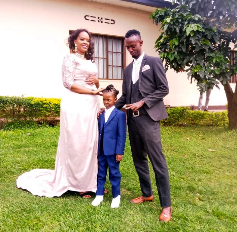 Iragire Saidi and Umubyeyi Dinha together with their child