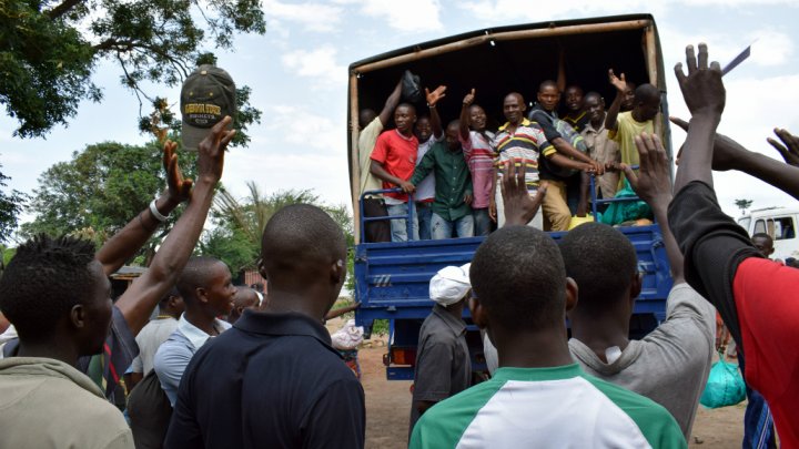 Former inmates wave from a lorry after having been released from the Mpimba central prison in Bujumbura on January 23, 2017