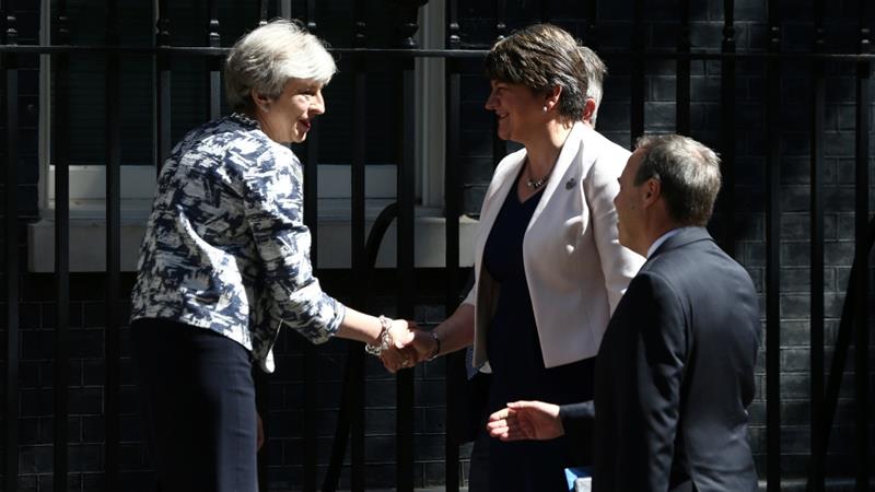 May shakes hands with DUP's Foster outside 10 Downing Street in central London