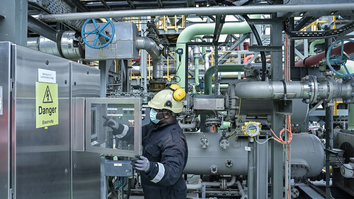A maintainance technician, is seen inside the barge extracting methane gas on Lake Kivu, at the Kivuwatt power plant in Kibuye, Karongi District, in the Western Province of Rwanda, on November 1, 2021. GasMeth Energy Limited has expanded its investment in the lake project to $560 million.
