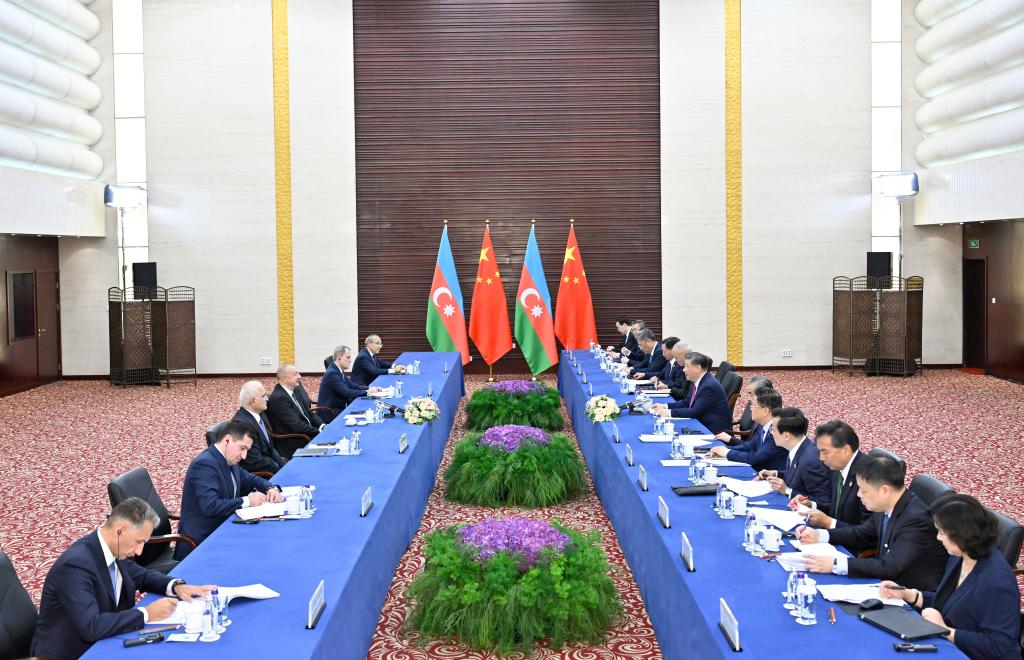 Chinese President Xi Jinping meets with Azerbaijani President Ilham Aliyev ahead of the 24th Meeting of the Council of Heads of State of the Shanghai Cooperation Organization in Astana, Kazakhstan, July 3, 2024. (Xinhua/Yue Yuewei)